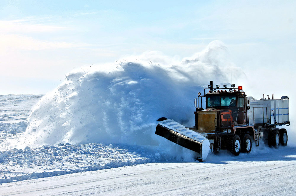 snow plower plowing snow